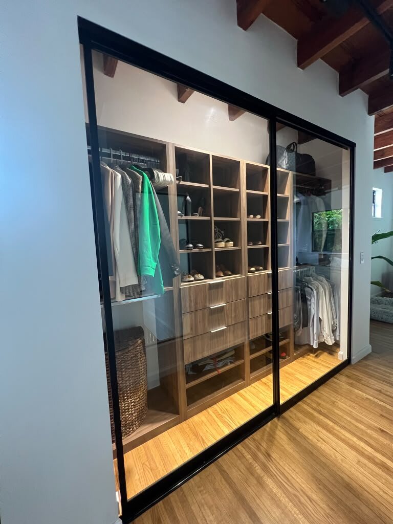 Black-framed glass sliding closet doors