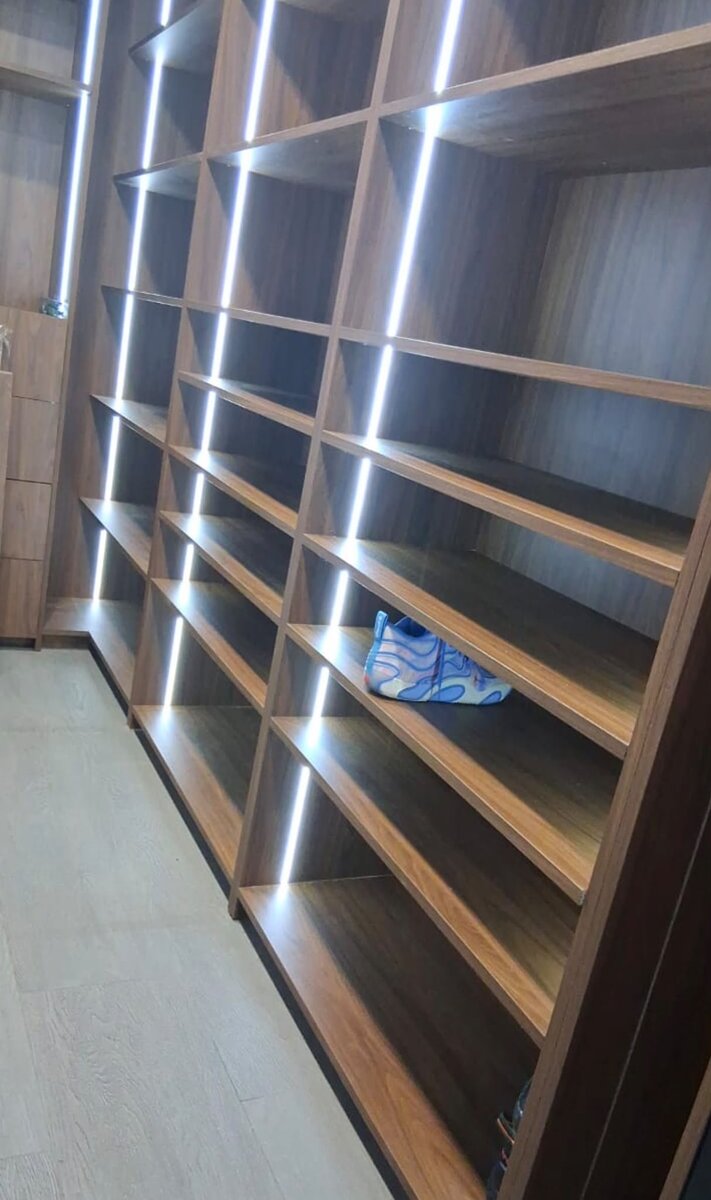 White closet system with open shelving and drawers