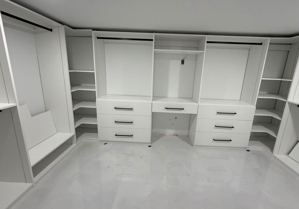 Taupe wardrobe with paneled doors and center drawers