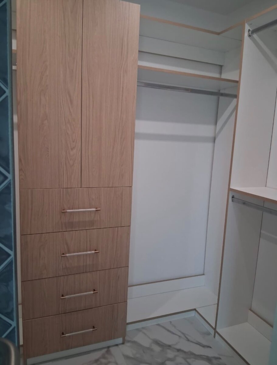 Matching his and hers walk-in closets with open shelving