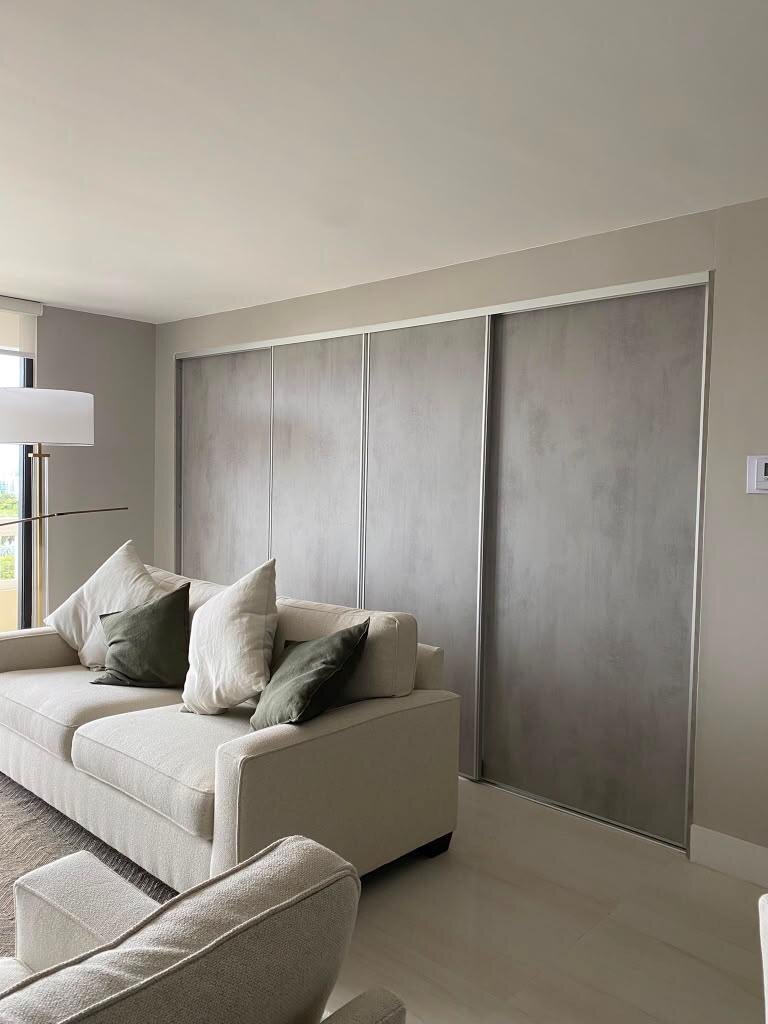 Gray sliding wardrobe doors in a living room